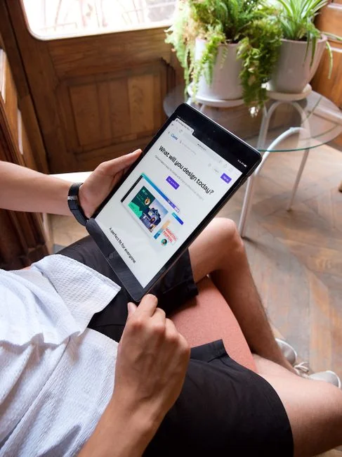 Person shopping online using a laptop and credit card, highlighting e-commerce convenience.